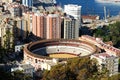 Malaga bullring and port. Royalty Free Stock Photo