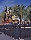 A group of bearers called Costaleros carrying a religious float