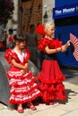 Girls in red flamenco dresses, Malaga, Spain.