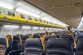 Half empty airplane passengers with face masks