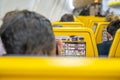 Man checks safety instructions inside plane