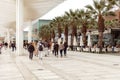 Malaga, Spain- 26-01-2024: Busy promenade in Malaga with people walking and outdoor cafes under a modern canopy, ideal