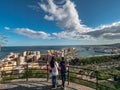 People in the viewpoint of Malaga . View of the port of Malaga, Spain and the city hall building