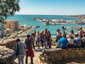 People in the viewpoint of Malaga . View of the port of Malaga, Spain and the city hall building