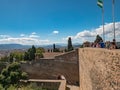 Tourists visiting Gibralfaro castle on a sunny day. Panorama view of the city skyline, the port