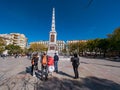 Tourists visiting the memorial obelisk dedicated to General Torrijos in Plaza de la Merced,