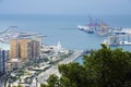 Buildings, port, bay, ships and mountains against a cloudy sky. Dramatic sky over the city. Beautiful view