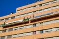 Workers on the exterior scaffold elevator