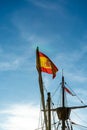 Black sailing yacht on sunset in port in Malaga, Spain on January 14, 2023