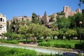 View of the Pedro Luis Alonso gardens with the castle to the rear, Malaga, Spain.