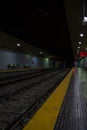 Almost empty underground train station. Platform without passengers