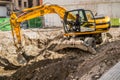 Working Excavator Tractor Digging A Trench Royalty Free Stock Photo