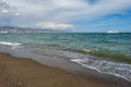 Malaga, Spain. May 4, 2018. Direct view of the beach of the city of the Mediterranean Sea. Huge tourist boat on the water. Holiday