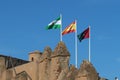 Flags of Andalusia, Spain and Malaga outside the Alcazaba of Malaga. Palatial fortification from the Islamic era built in the 11th