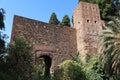 Tower and defensive walls of the Alcazaba of Malaga. Palatial fortification from the Islamic era built in the 11th century