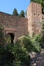 Vertical view. Tower and defensive walls of the Alcazaba of Malaga. Palatial fortification from the Islamic era built in the 11th