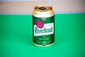 Bottle of Pilsner Urquell beer on green background in Malaga, Spain on November 17, 2023