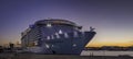 `Symphony of the seas` the biggest cruise ship built in the port of Malaga at dusk