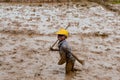 Malagasy farmers plowing agricultural field