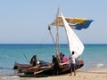 Malagasy fishing canoe on the beach with fishermen