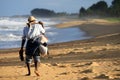 Malagasy man walking on a beach