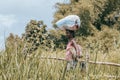 Malagasy woman carry heavy loads on head. Madagascar