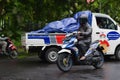 a cyclist crosses the highway and runs into a pickup on a less crowded road in Malang City