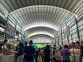 bustling atmosphere inside a traditional market with shoppers at the stalls