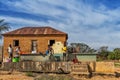 MALANJE/ANGOLA - 10 MAR 2018 - African women and children washing clothes at a water source in rural Africa, Angola. Malanje. Royalty Free Stock Photo