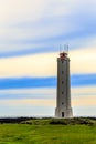 Malariff lighthouse tower standing on the seashore with striped