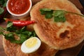 Malawach with hard boiled eggs and tomatoes. Malawach or malawah: traditional fried bread of Yemenite Jews