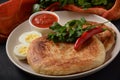 Malawach with hard boiled eggs and tomatoes. Malawach or malawah: traditional fried bread of Yemenite Jews