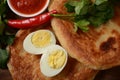 Malawach with hard boiled eggs and tomatoes. Malawach or malawah: traditional fried bread of Yemenite Jews