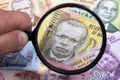 Malawian money in a magnifying glass Royalty Free Stock Photo