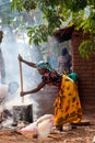Malawian Woman Cooking Nsima Over Fire Royalty Free Stock Photo