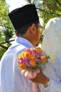 Malay Couple hold Wedding Flower Bouquet Royalty Free Stock Photo