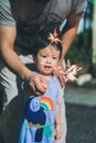 Malay kids playing with sparkler with their family during Ramadan night