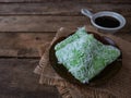 A Malay traditional dessert called Kuih Lopes on right conner over wooden background Royalty Free Stock Photo