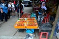Malay woman stall owner sells fresh strawberries at street market bazaar Cameron Highlands Malaysia