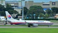 Malaysia Airlines Boeing 737 taxiing at Changi Airport Royalty Free Stock Photo