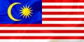 Malaysia country flag on silk or silky waving texture Royalty Free Stock Photo