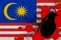 Malaysia flag and MK2 frag grenade in red blood. Concept for terror attack or military operations with lethal outcome