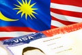 Malaysia immigration document close up. Passport visa on Malaysia flag. Malaysia visitor visa in passport,3D rendering. Malaysia Royalty Free Stock Photo