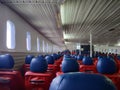 Malaysia - June 2019: Green and blue seats on the boat