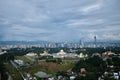 Malaysia National Palace over Kuala Lumpur skyline during cloudy afternoon