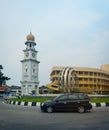 MALAYSIA, PENANG, GEORGETOWN - CIRCA JUL 2014: The Queen Victoria Memorial Clock Tower stands proudly over a contemporary Royalty Free Stock Photo