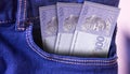 Qatar 5 Riyals Banknotes in Pocket of Jeans