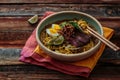 Malaysia Spicy Noodle Mee Rebus With Beef Egg and fried onion, copy space