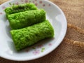 A Malaysia traditional dessert and locally know as Kuih Ketayap served on plate with selective focus. Royalty Free Stock Photo