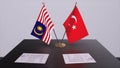 Malaysia and Turkey flags at politics meeting. Business deal 3D illustration